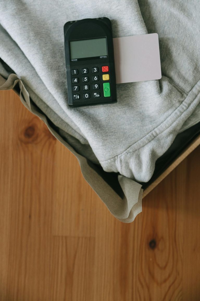A payment terminal with a card on clothing for online shopping concept.